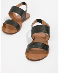 Черные кожаные сандалии на плоской подошве от Love Moschino