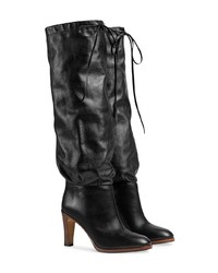 Черные кожаные сапоги от Gucci