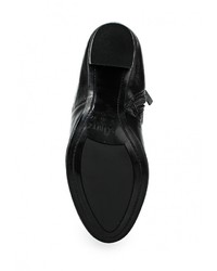 Черные кожаные сапоги от Schutz