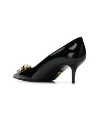 Черные кожаные туфли с украшением от Versace