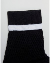 Женские черные носки в крупную сеточку от Monki