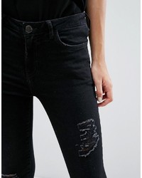 Черные рваные джинсы скинни