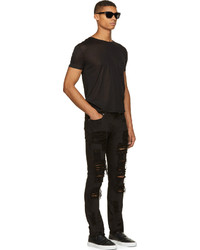 Мужские черные рваные зауженные джинсы от Versace