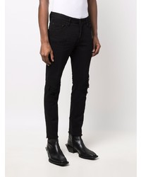 Мужские черные рваные зауженные джинсы от DSQUARED2