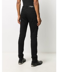 Мужские черные рваные зауженные джинсы от Balmain