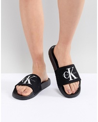 Черные сандалии на плоской подошве из плотной ткани с вышивкой от Calvin Klein