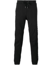 Мужские черные спортивные штаны с цветочным принтом от Versace