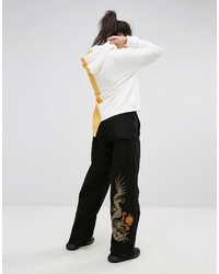Черные широкие брюки с вышивкой от MHI