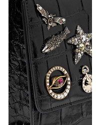 Черный кожаный клатч с украшением от Alexander McQueen