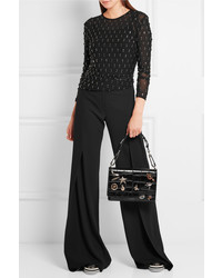 Черный кожаный клатч с украшением от Alexander McQueen