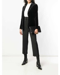 Черный кожаный клатч со змеиным рисунком от Alexander McQueen