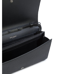 Черный кожаный клатч от Saint Laurent