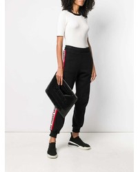 Черный кожаный стеганый клатч от Corto Moltedo