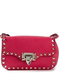 Ярко-розовая кожаная сумка-саквояж от Valentino Garavani