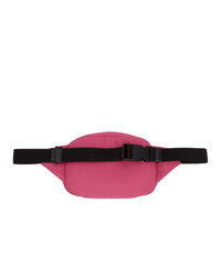 Ярко-розовая нейлоновая поясная сумка от Prada