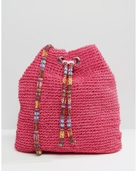Ярко-розовая соломенная сумка через плечо