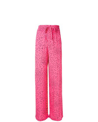 Ярко-розовые широкие брюки с цветочным принтом от Ganni