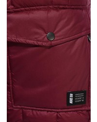 Женский ярко-розовый пуховик от Nike