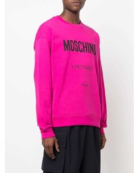 Мужской ярко-розовый свитшот с принтом от Moschino